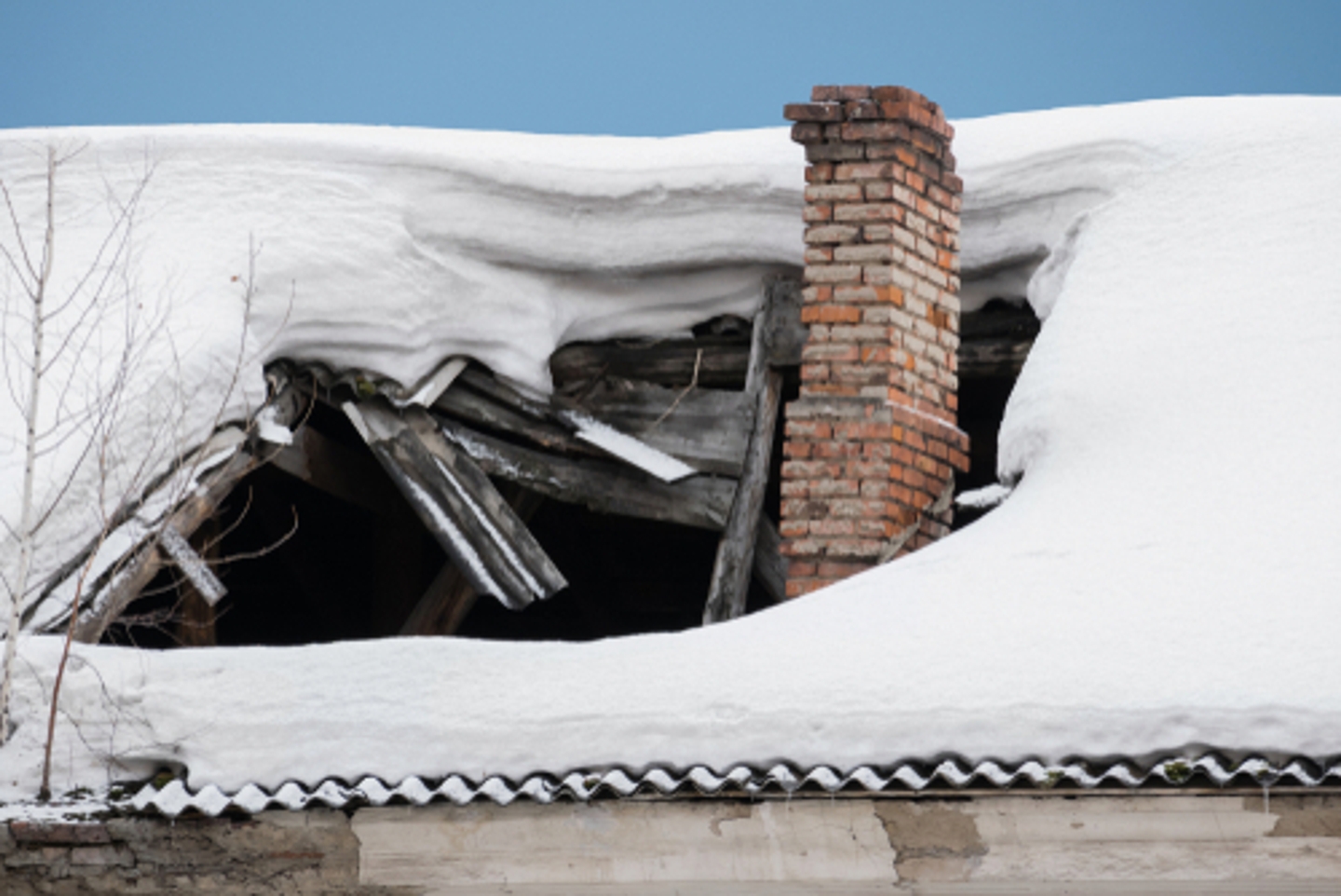 a roof with a chimney and snow on it a roof with a chimney and snow on it