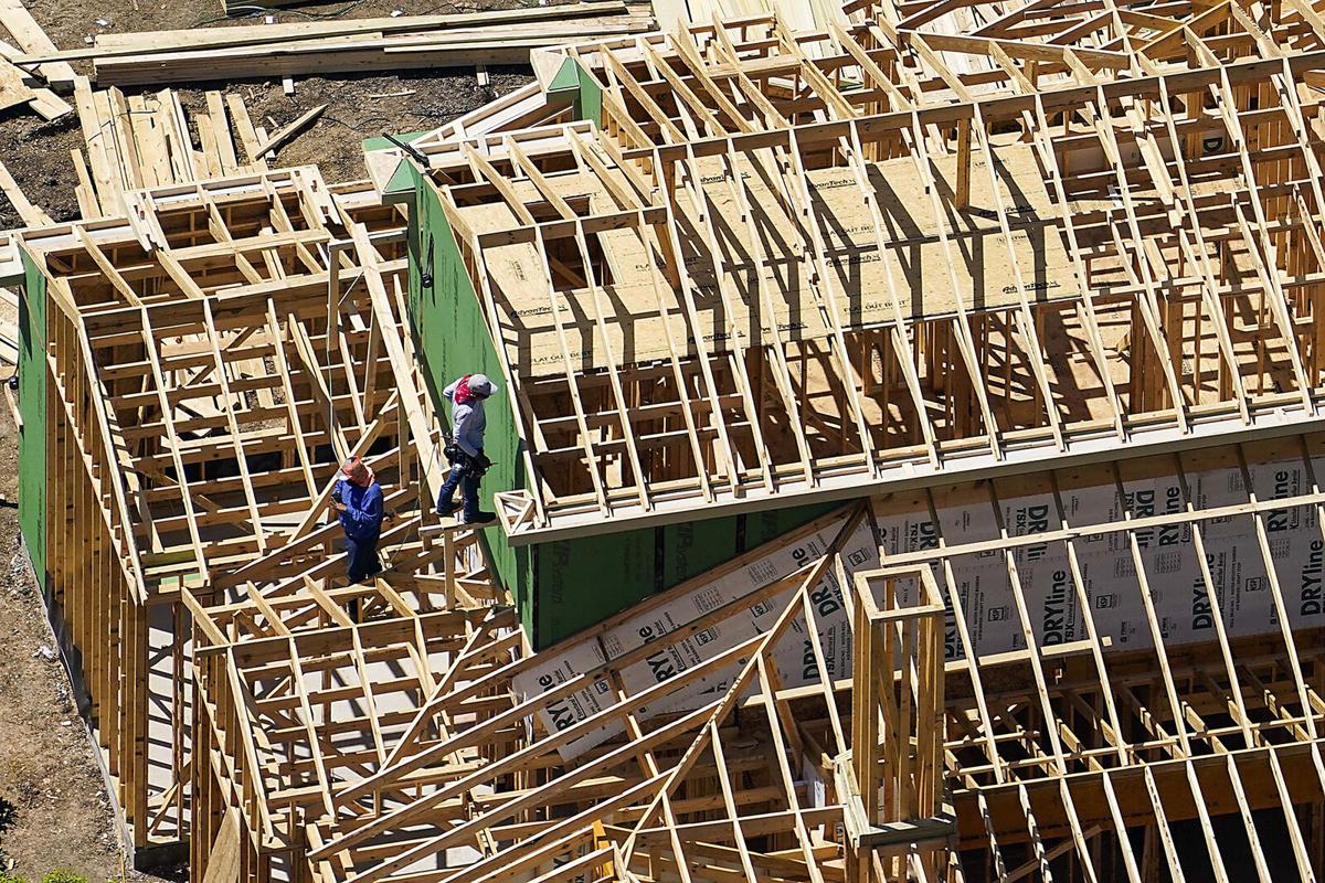 a group of people working on a building a group of people working on a building